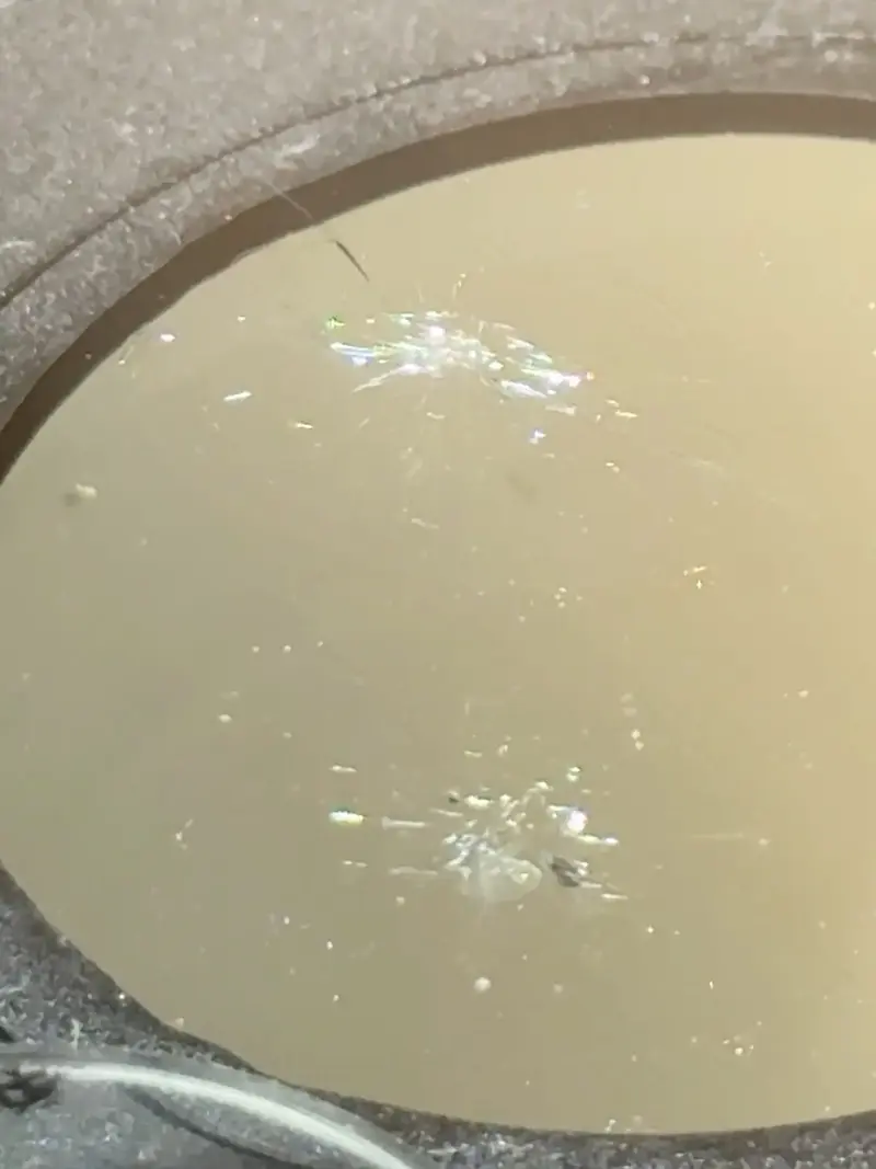 Completed windshield chip repairs with only faint blemishes remaining.