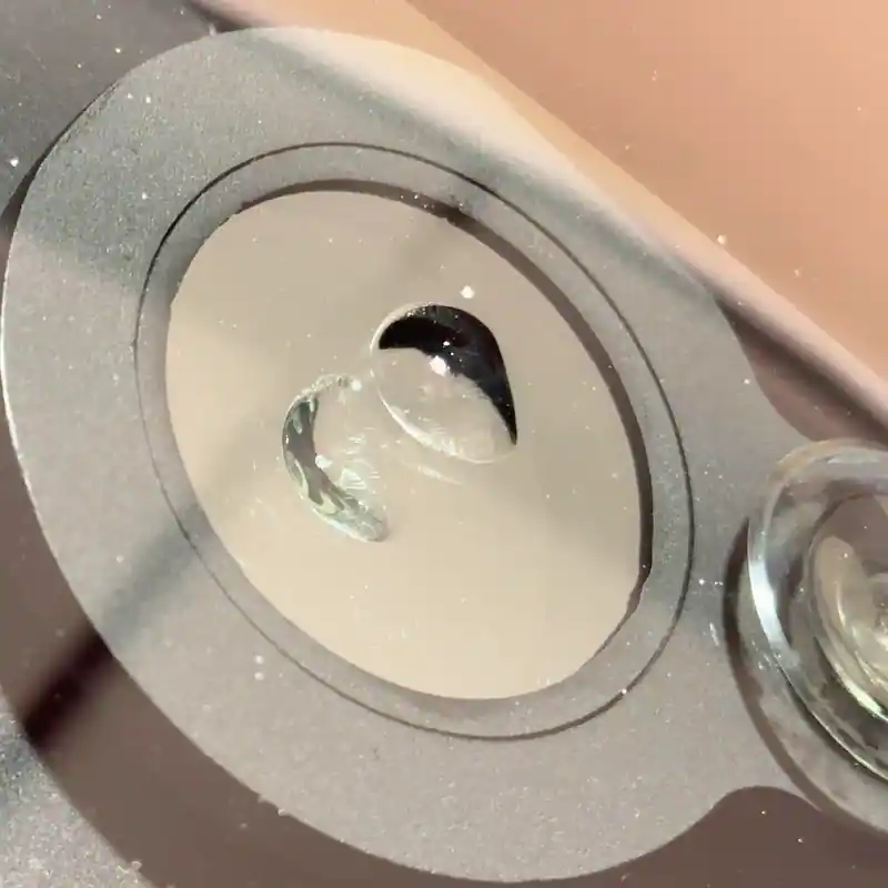 Close-up view of a windshield bullseye chip using inspection mirror.